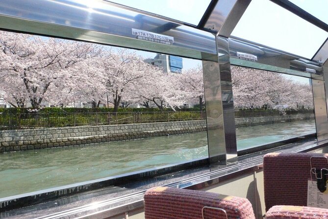 1 Day Takoyaki Making and Osaka Castle Walking Tour - Riding the retro tram: a tiny time machine in Osaka
