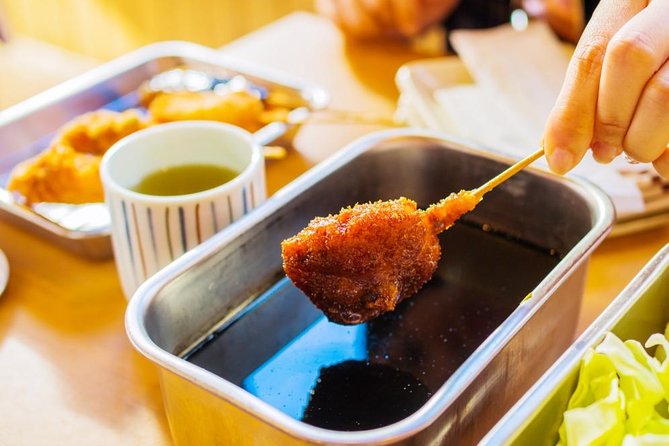 Absolute Osaka Food Tour - Stop 1: Dotombori Glico Sign, the story behind the mascot