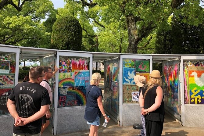 Hiroshima 3hr Peace Cycling Tour with Local Guide - Stop 3, Hiroshima Gokoku Shrine gate and guardian dog details