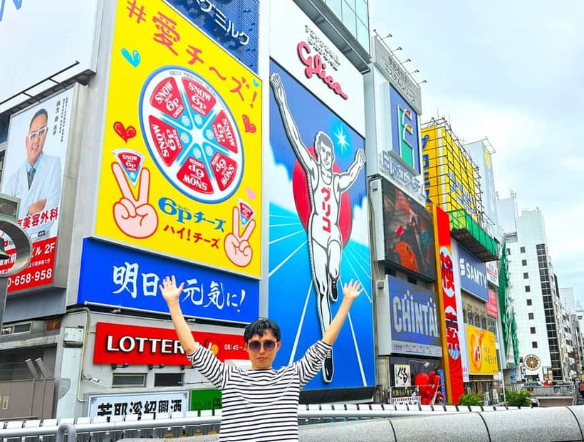 Osaka: 2-Hour Local Street Food Tour - Dotonbori & Namba - Second Dotonbori pass and the final photo moment: how the guide ties it together