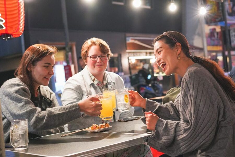 Osaka: Bar-Hopping Night Tour in Namba - First izakaya bar: fried skewers and easy local ordering