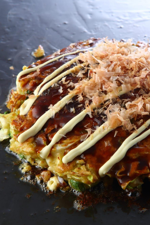 Osaka: Cooking Class & Sake Tasting with Local Market Visit - Studio Cooking Flow: Niku-sui, Okonomiyaki, Gyoza