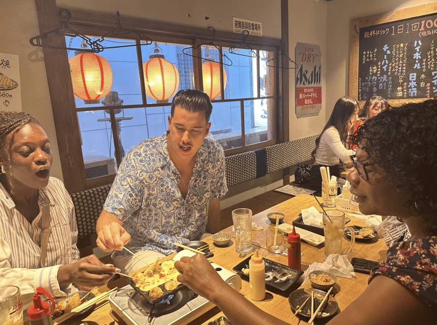 Osaka: Izakaya Bars Guided Walking Tour - Meeting at the Dotombori Humanity Song Monument, and why that matters