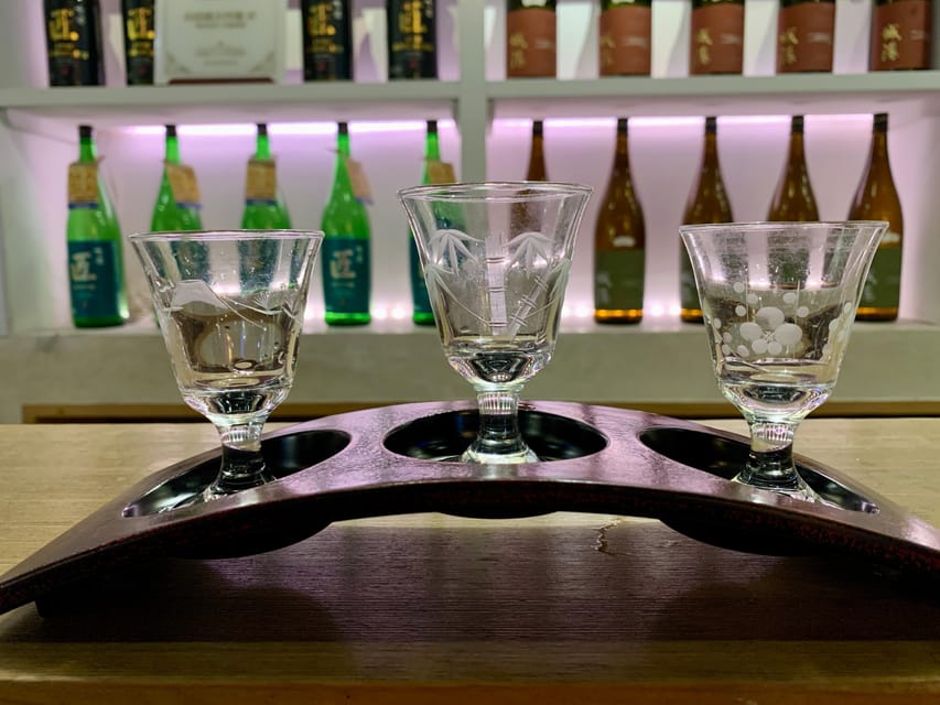 Osaka: Namba Pub Bar Crawl with a Local Guide - Stop 2 in Shinsaibashi: spirits, local snacks, and easier conversation