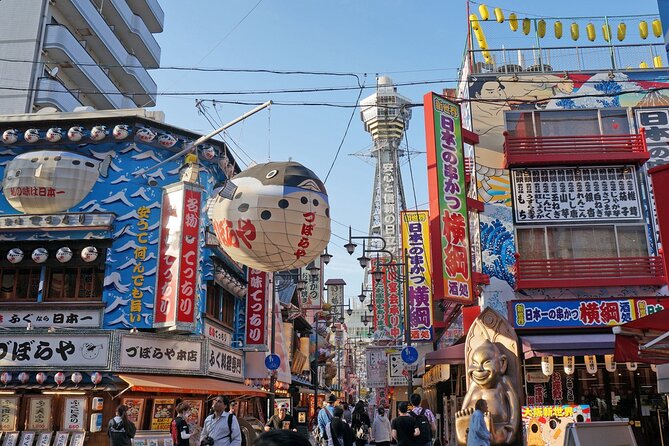 Osaka & Nara in 1-Day by Private Van with Local Expert Guide - Dotonbori neon energy: running man sign, riverside lights, and street food focus