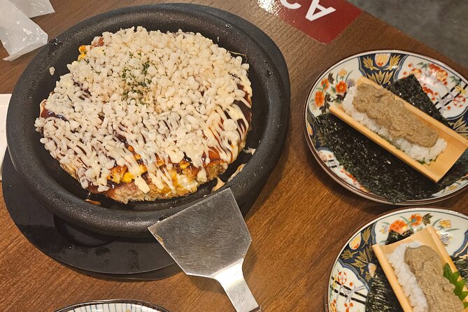 Osaka: Shinsekai Food Tour - 13 Dishes at 5 Local Eateries - Stop 2: Shinsekai streets and Tsutenkaku, Osaka’s retro photo moment