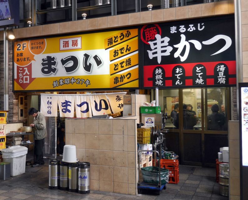 Osaka: Small Group, Big Flavors & Hidden Local Secrets Tour - The Short Train Hop (3 to 4 minutes): Two Osaka Personalities, One Evening