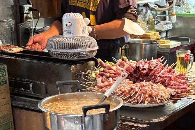 Tokyo: Shinjuku Bar Hopping & Night Walking Tour - Stop 1: Omoide Yokocho, lanterns and office-worker dinners